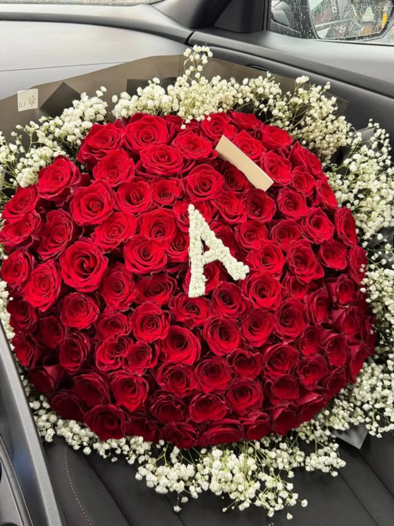 Luxury 100 red roses with letter design arranged by Boston Flowers for Boston delivery