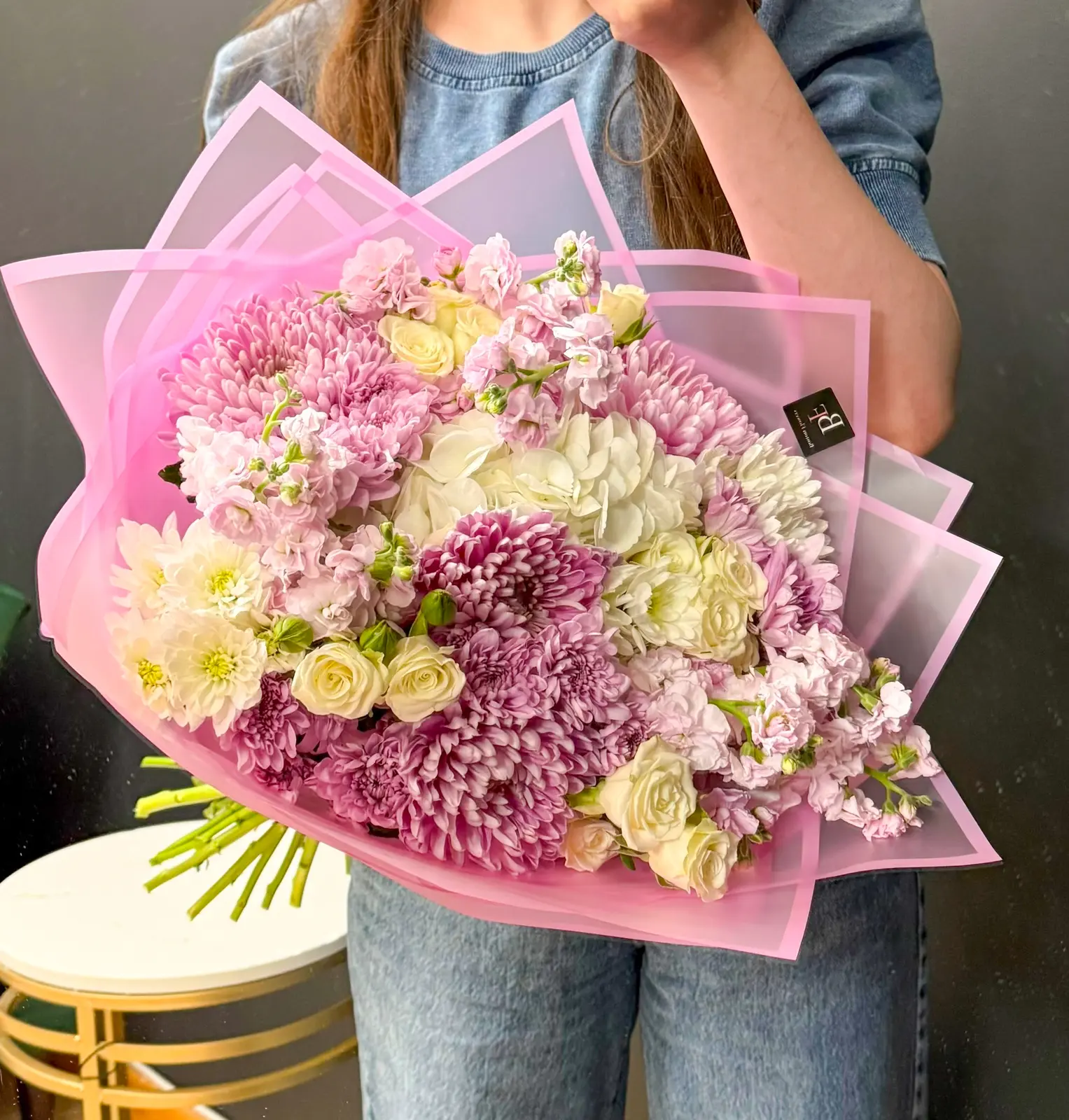 Avon Sonata bouquet with pink chrysanthemums, white hydrangea, cream roses, and pink stock flowers