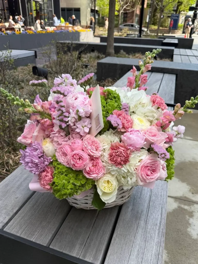 Pink Garden Basket with roses, hydrangeas, and seasonal blooms by Boston Flowers, main view