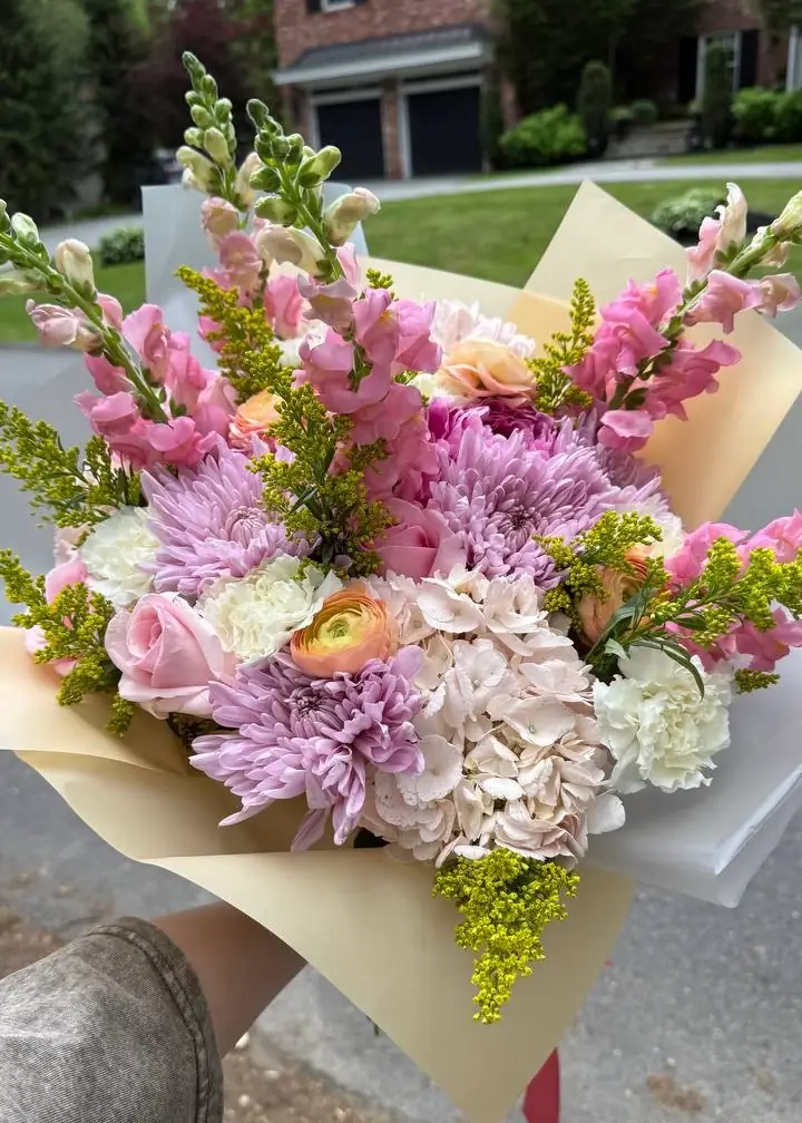 Luxury pink roses and peach ranunculus mixed bouquet arrangement by Boston Flowers for delivery in Boston