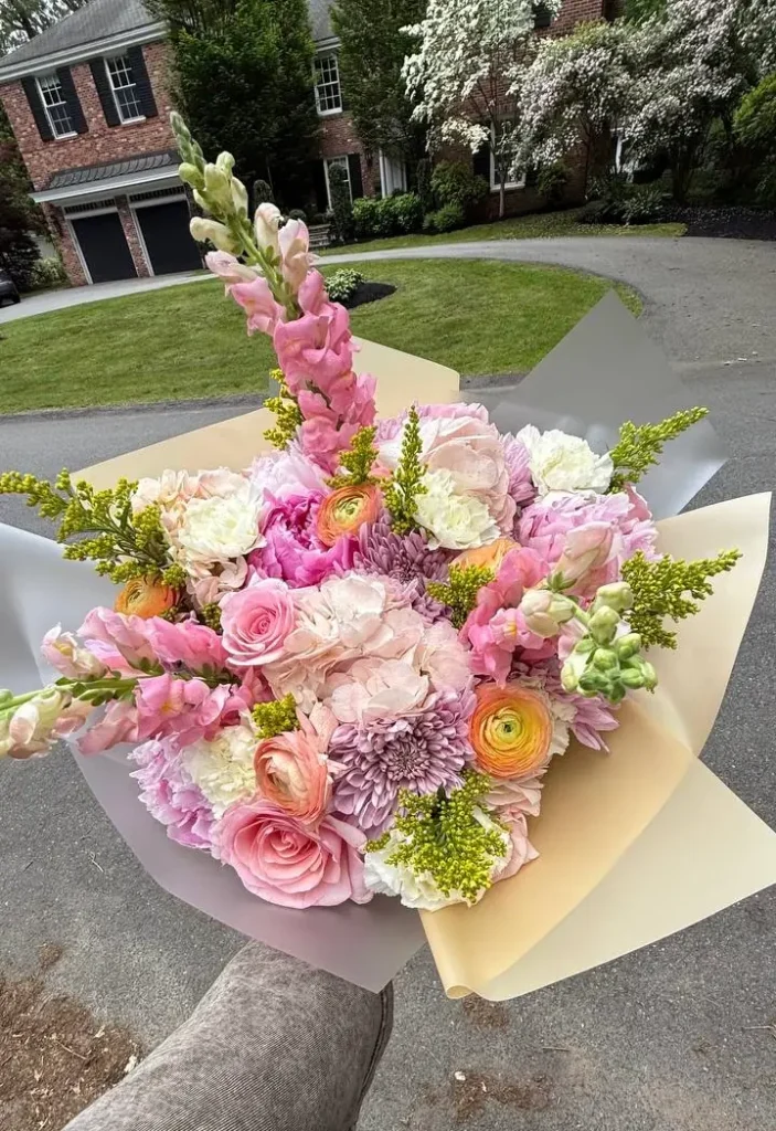 Luxury pink roses and peach ranunculus mixed bouquet arrangement by Boston Flowers for delivery in Boston