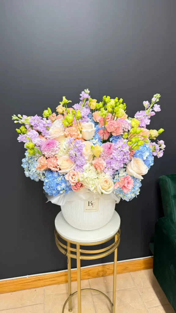 Rowley Rhapsody pastel hydrangea and rose bouquet in a white Boston Flowers vase