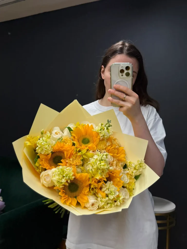 Fenway Sunbeam bouquet of sunflowers, cream roses, white stock and pale yellow accents in butter yellow wrap, view 3