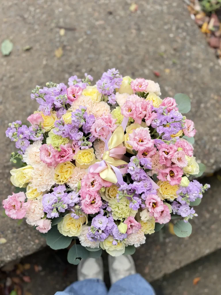 New England Lilac Garden pastel flower basket with yellow roses, pink lisianthus, lavender stock and eucalyptus, view 3