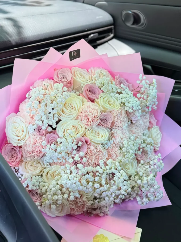 Newbury Street Blush bouquet of ivory and dusty pink roses, blush carnations and baby's breath in soft pink wrap, view 2