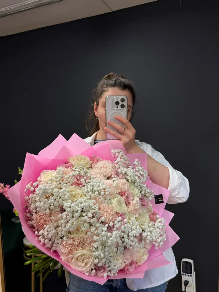 Newbury Street Blush bouquet of ivory and dusty pink roses, blush carnations and baby's breath in soft pink wrap, view 3